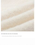 Close-up of a kawaii rabbit sweater, featuring a soft, textured fabric.