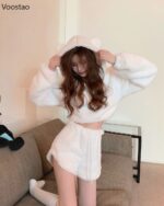 White bear pajamas set featuring a hooded sweatshirt and shorts, soft plush fabric.