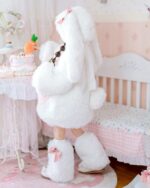 Child wearing an easter bunny costume with boots and a fluffy hood.