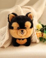 Close-up of a brown and black puppy collectible plush with a tag and stitched face.