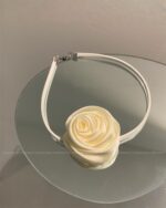 Oversize bow choker featuring a cream-colored rose design, coquette bow choker.