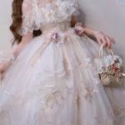 Close-up of a floral lolita dress featuring ruffles, lace, and floral embellishments.