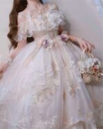 A pink floral lolita dress with ruffles and lace details, featuring a basket and accessories.