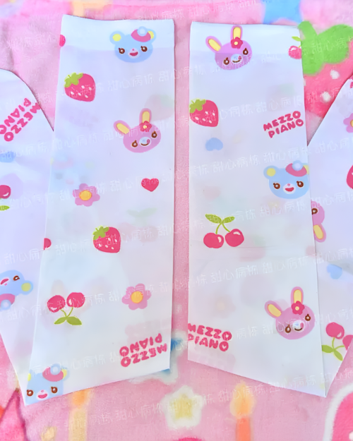 Bunny Strawberry Socks and Sleeves decorative packaging with strawberries and bunny illustrations.