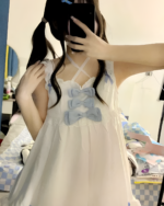 White Yume Kawaii Set featuring a bow-detailed top and ruffled skirt. Cute aesthetic lingerie.