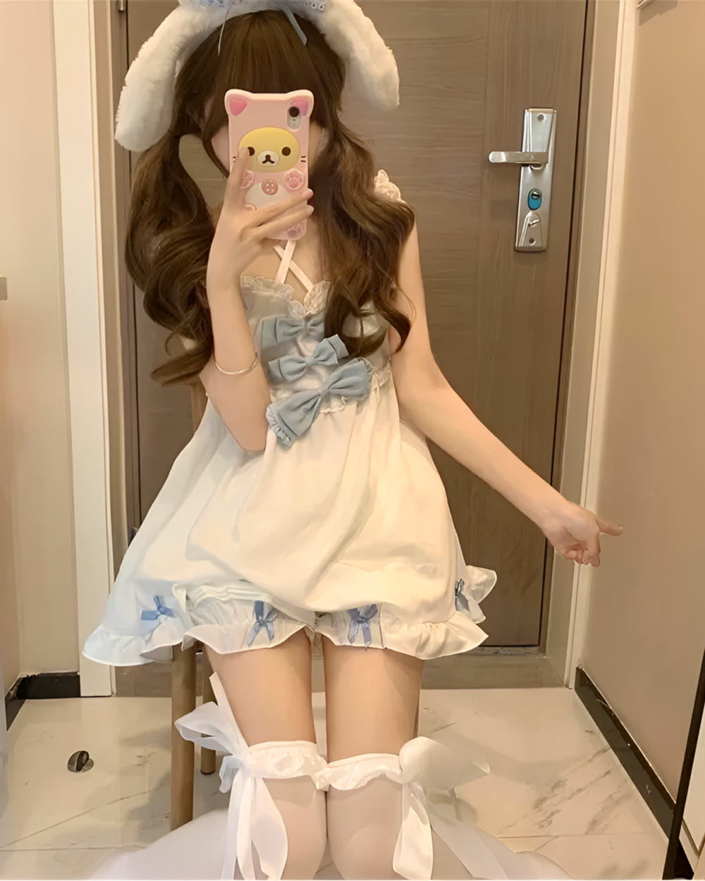 Model wearing a white and blue Yume Kawaii Set, featuring a bow and ruffled shorts.