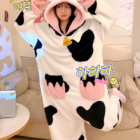 A white Cow Onesie with black spots, featuring a hood and ears. Kawaii pajamas.