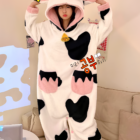 A pink and black Cow Onesie - Kawaii Pajamas with hood and ears, featuring a cozy fleece design.
