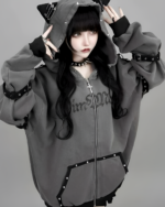 Model wearing a Dark Cat Hoodie, gray soft grunge aesthetic hoodie with cat ears and details.