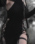 Close-up of a black Nu-Goth Aesthetic Dress with cutouts and lacing details.