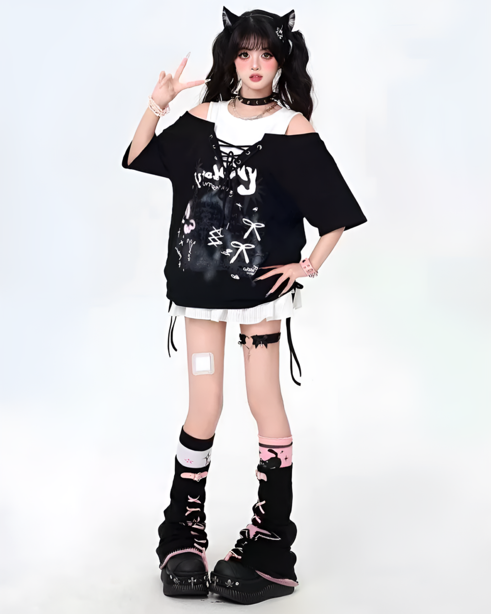 Model wearing a Grunge Aesthetic Top, a black oversized t-shirt with graphic print, and combat boots.