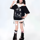 Model wearing a Grunge Aesthetic Top, a black oversized t-shirt with graphic print, and combat boots.