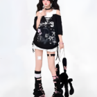 Model wearing a Grunge Aesthetic Top with layered accessories and platform boots.