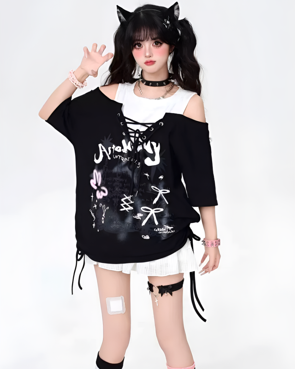 Black Grunge Aesthetic Top with ripped details and graphics. Features a distressed, oversized design.