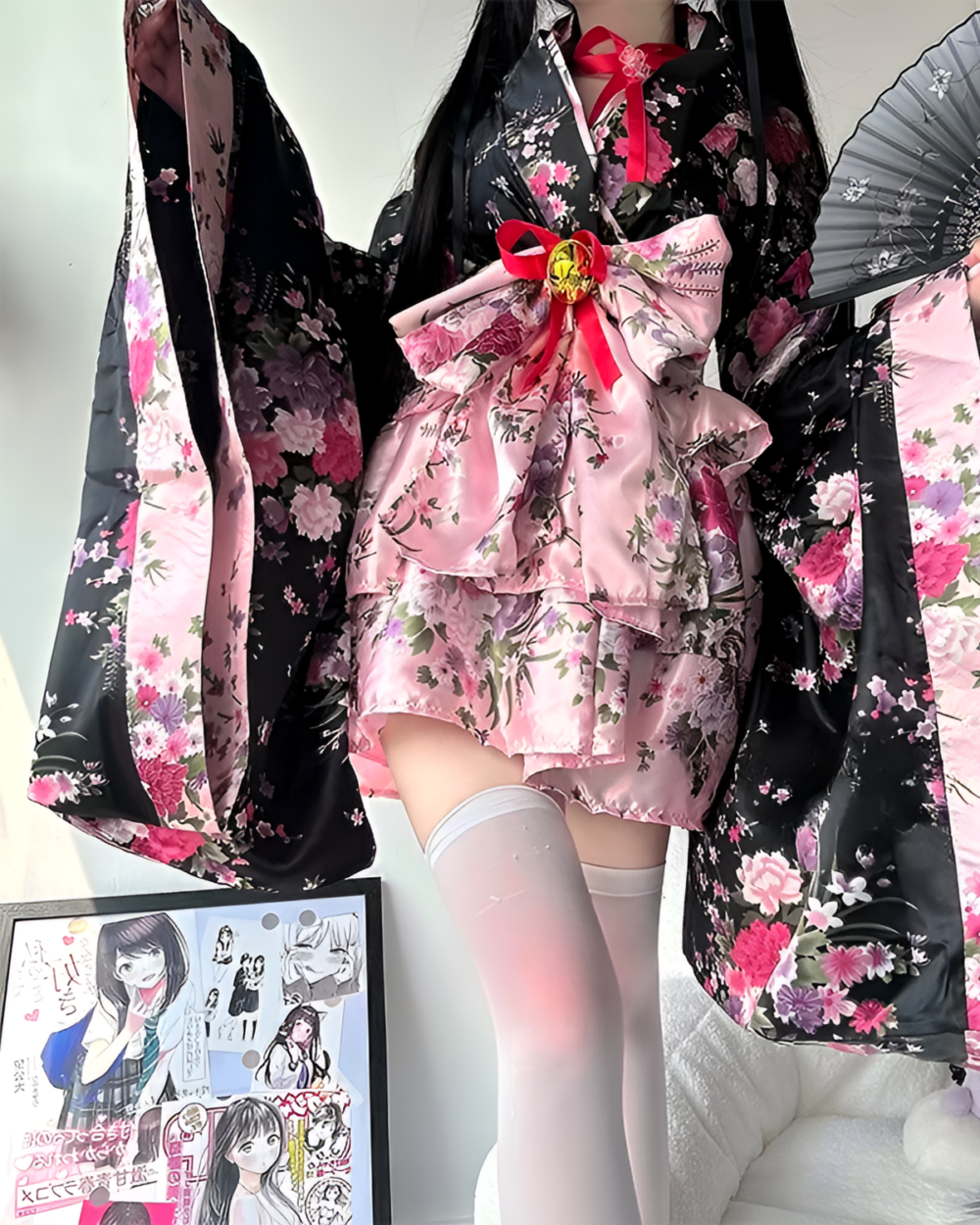 Floral Short Yukata featuring a pink and black floral print, worn with matching accessories.