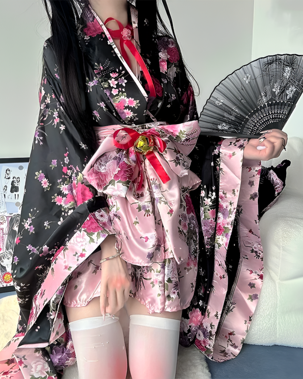 Floral Short Yukata featuring a pink and black floral print, with a wide belt and stockings.