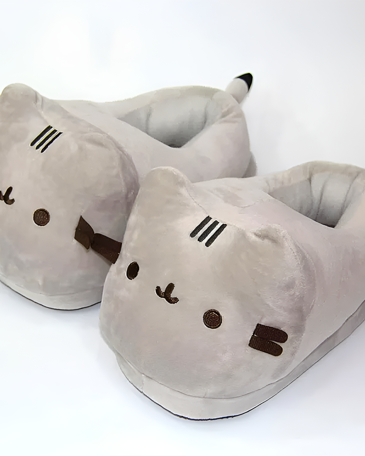 Fluffly Pusheen Slippers product photo 1 Gray Fluffly Pusheen slippers featuring a cute cat face design and soft interior.