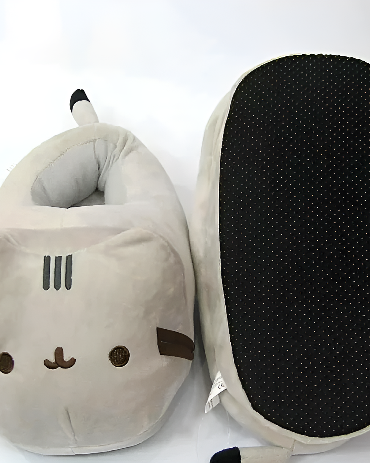 Grey Fluffly Pusheen slippers with a non-slip sole. Cute and cozy footwear.
