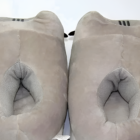 Close-up of gray Fluffly Pusheen slippers with plush lining.