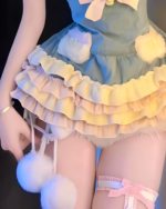 Close-up of a Yume Kawaii Dress, a fluffy bunny-themed mini dress with ruffles and pom-poms.