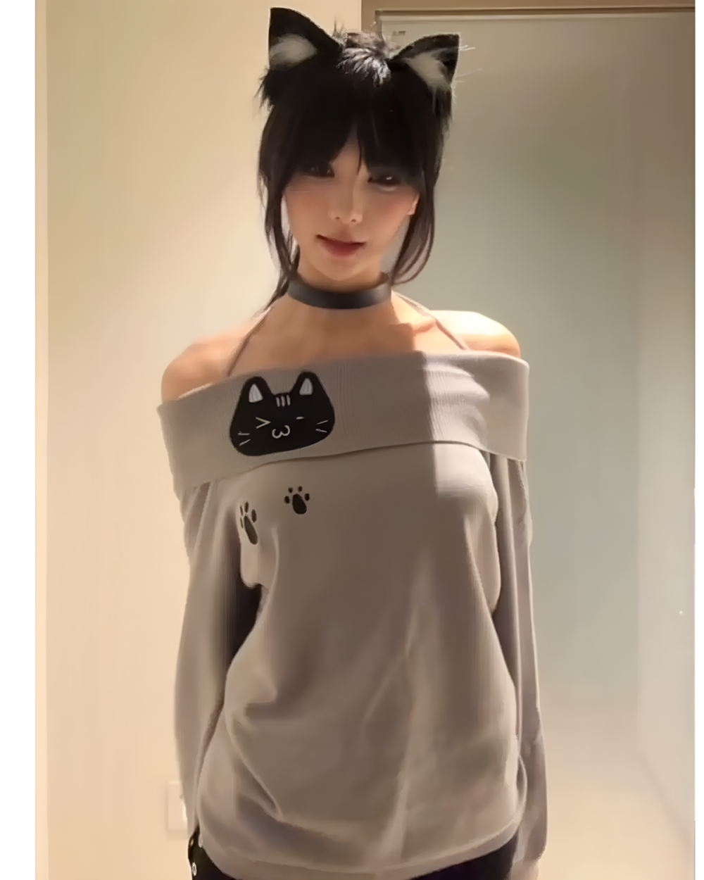 Model wearing a Grak Cat Off-Shoulder T-Shirt with cat ears and paw prints.