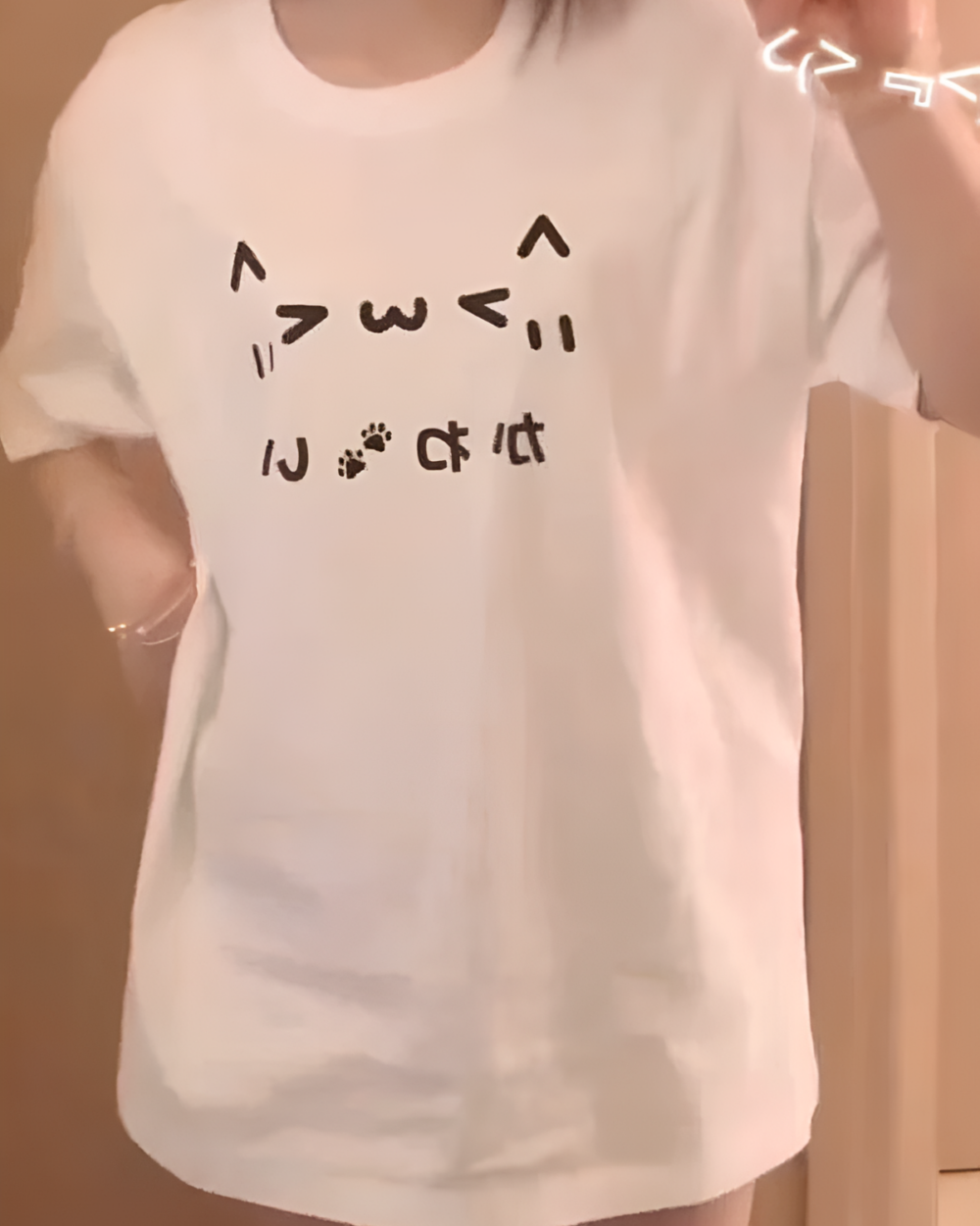 White Kaomoji Cat T-Shirt with cute emoji design.