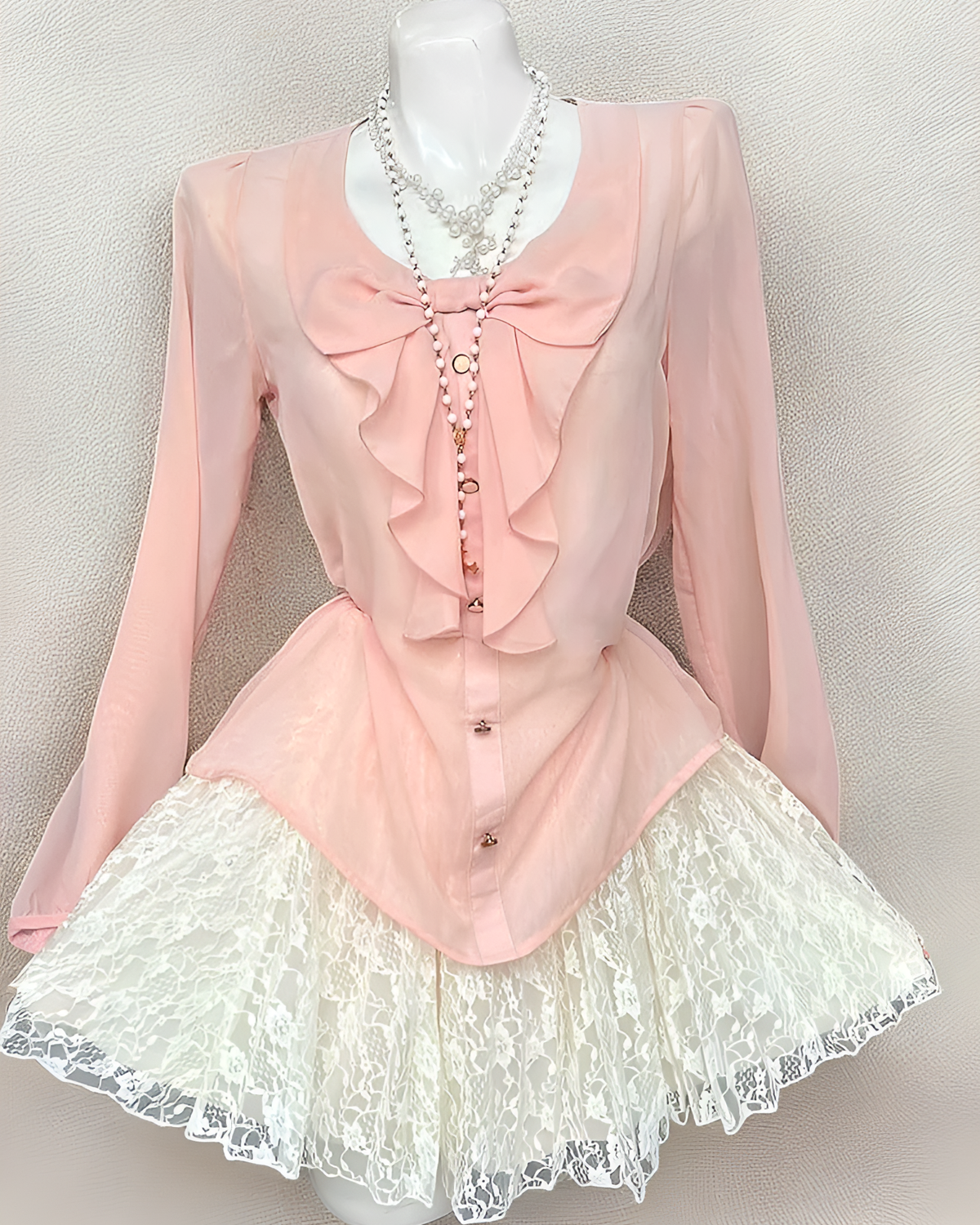 Pink long sleeves Dollette Aesthetic Set featuring a ruffled blouse and lace skirt.