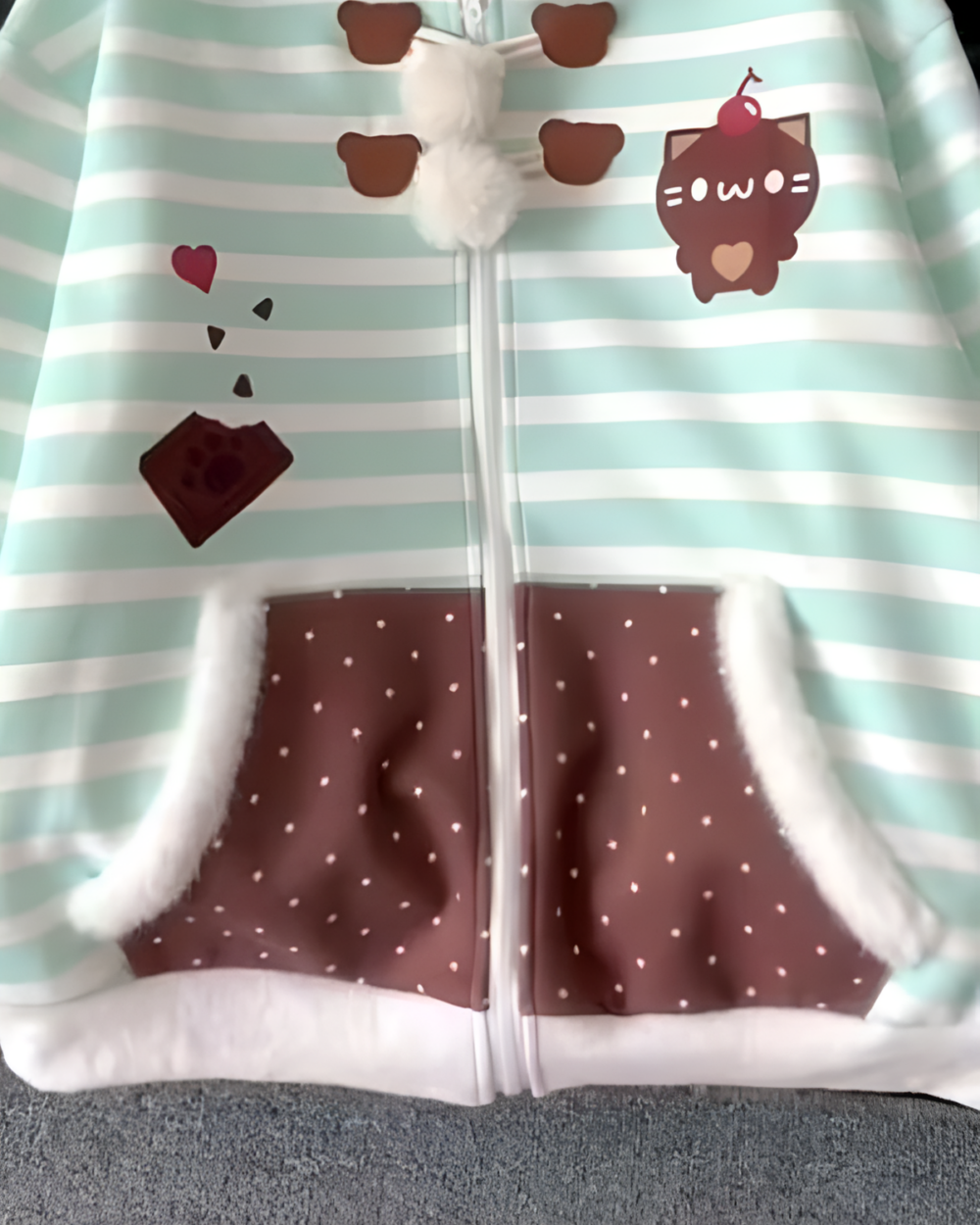 Mint Furry Hoodie featuring a mint green striped design with chocolate and cat illustrations.