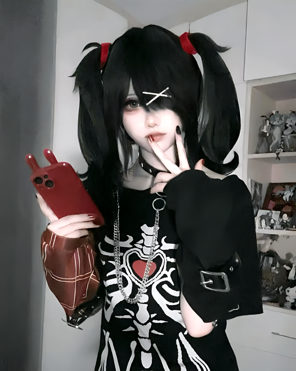 Person wearing a Needy Girl Overdose T-Shirt with E-Girl aesthetic, holding a phone.