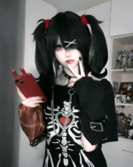 Person wearing a Needy Girl Overdose T-Shirt with E-Girl aesthetic, holding a phone.