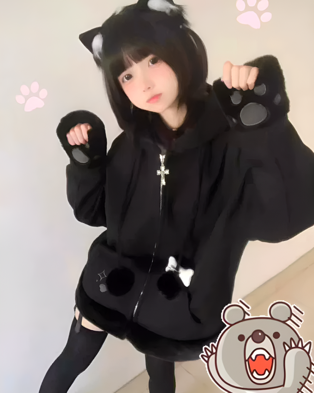 Person wearing a Neko Paw Hoodie with cat paw sleeves.