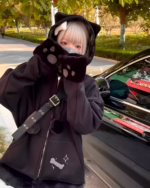Person wearing a Neko Paw Hoodie featuring paw-shaped ear covers and a bone graphic.
