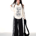 Model wearing a Grunge Butterfly Top, off-shoulder design, with lace trim and black accessories.