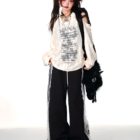 Off-shoulder Grunge Butterfly Top worn by a model, featuring a distressed aesthetic.