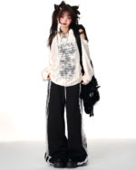 Off-shoulder Grunge Butterfly Top worn by a model, featuring a distressed aesthetic.