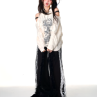 Off-shoulder Grunge Butterfly Top with distressed print and layered styling.