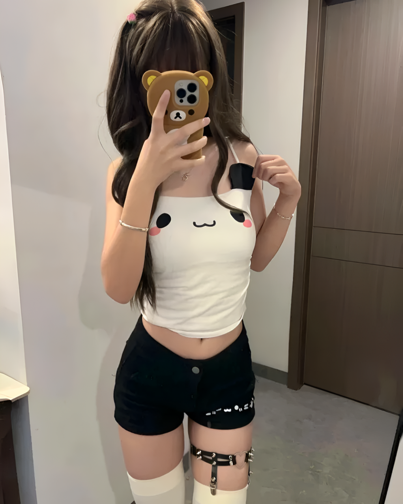 Person wearing a Kawaii Panda Vest Top, black shorts, and thigh-high socks.