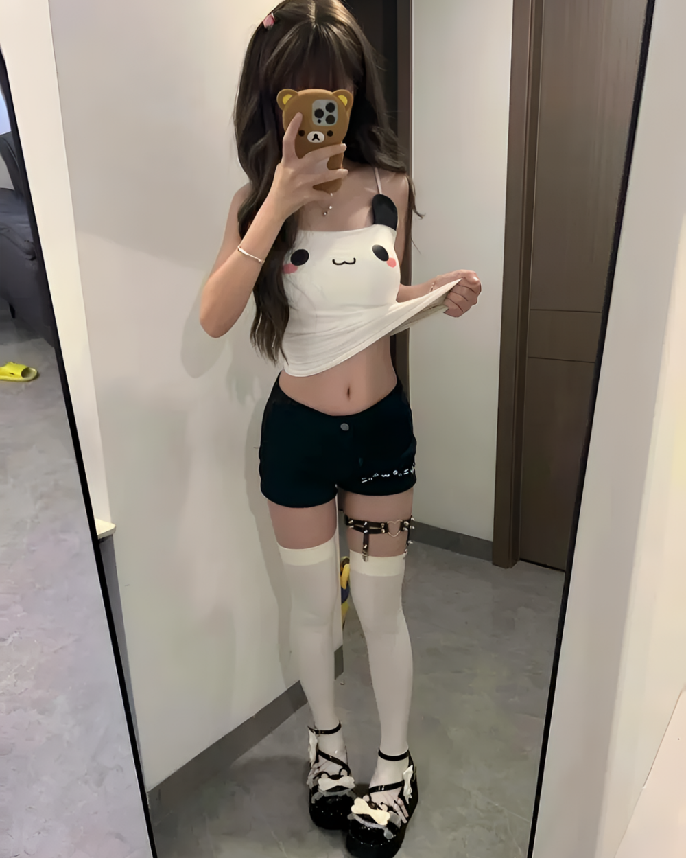 Kawaii Panda Vest Top worn by a person in a mirror selfie.