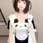 A person wearing a Kawaii Panda Vest Top, featuring a panda face print on a white shirt.