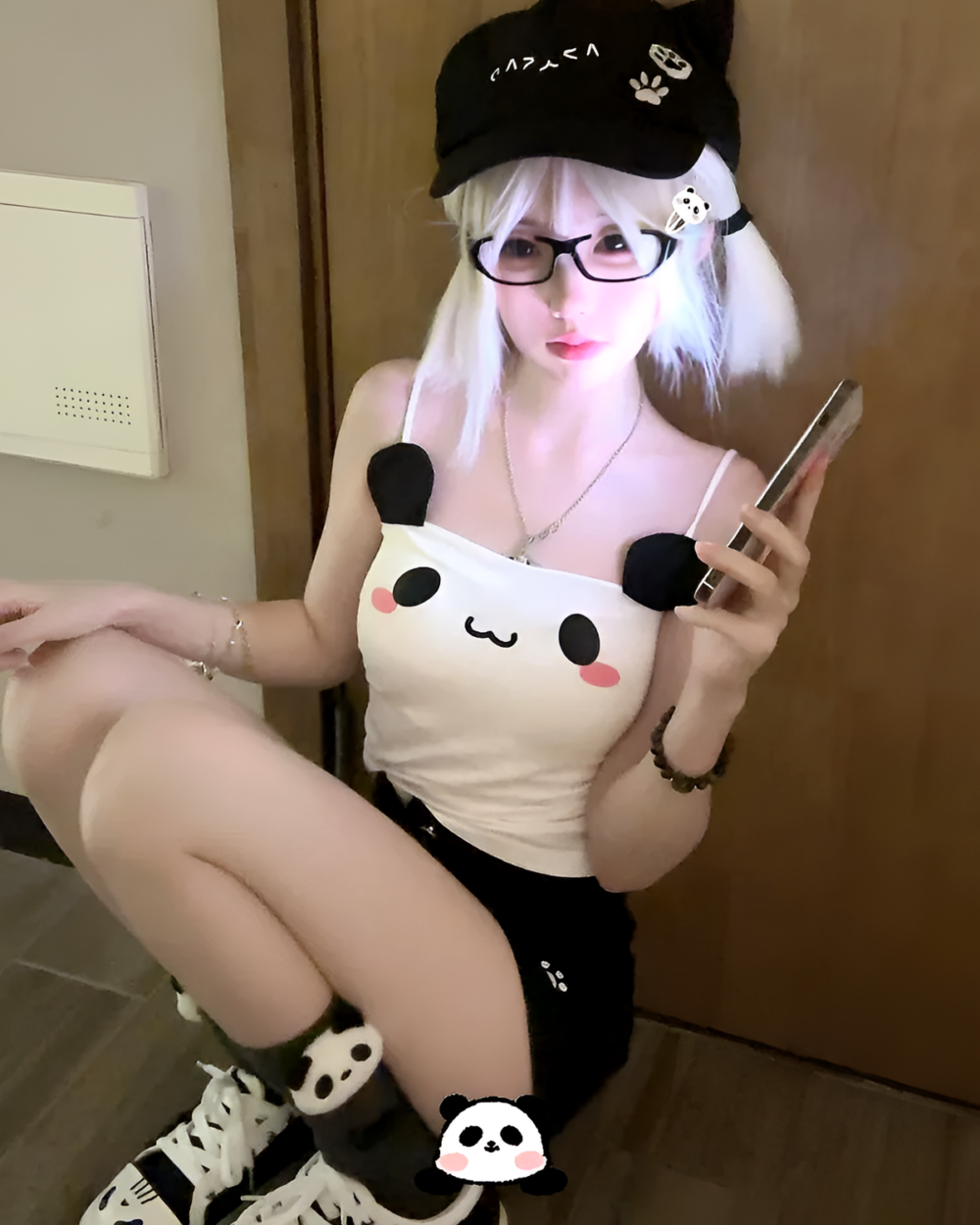 Woman wearing a Kawaii Panda Vest Top with panda ears and paws.