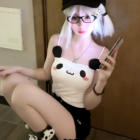 Woman wearing a Kawaii Panda Vest Top with panda ears and paws.