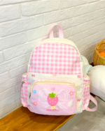 Pink and white Plaid Strawberry Backpack with floral accents, Jojifuku Aesthetic.