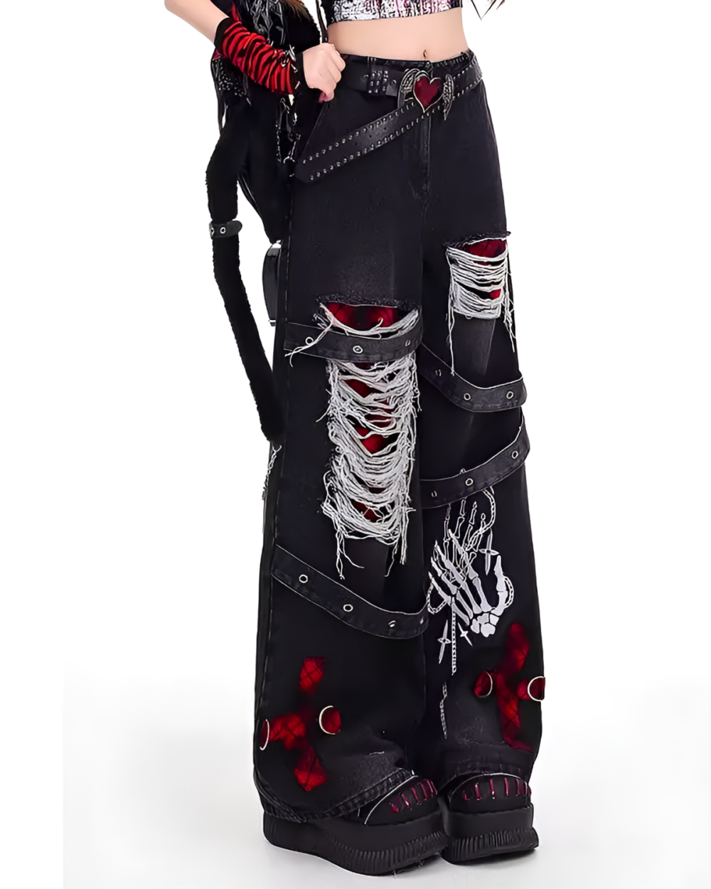 Black Y2K aesthetic pants with rips, bones, and decorative hardware.