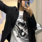 White Rocker Cat T-Shirt with graphic design, worn as part of an outfit.