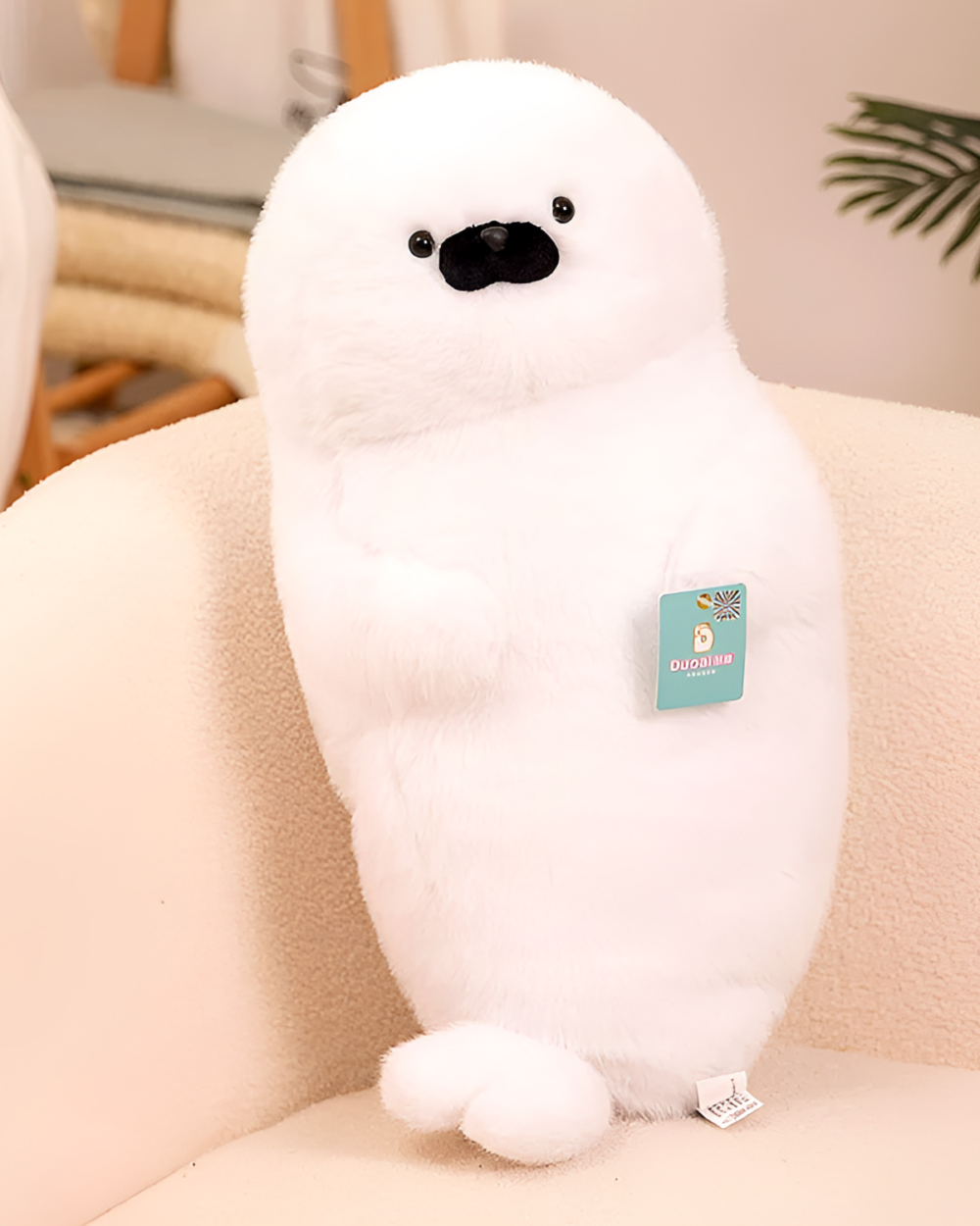 Close-up of a white Kawaii Seal Plushie, soft and cuddly toy.