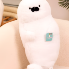 Close-up of a white Kawaii Seal Plushie, soft and cuddly toy.