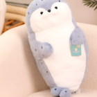 Kawaii Seal Plushie, a soft, blue, long-armed plush toy with black eyes and paws.