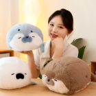 Kawaii Seal Plushie and Otter Plushies displayed with a person.