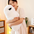 Kawaii Seal Plushie held by a person in a cozy room setting.