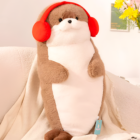 A brown Kawaii Seal Plushie wearing red earmuffs and sitting on a sofa with a newspaper.